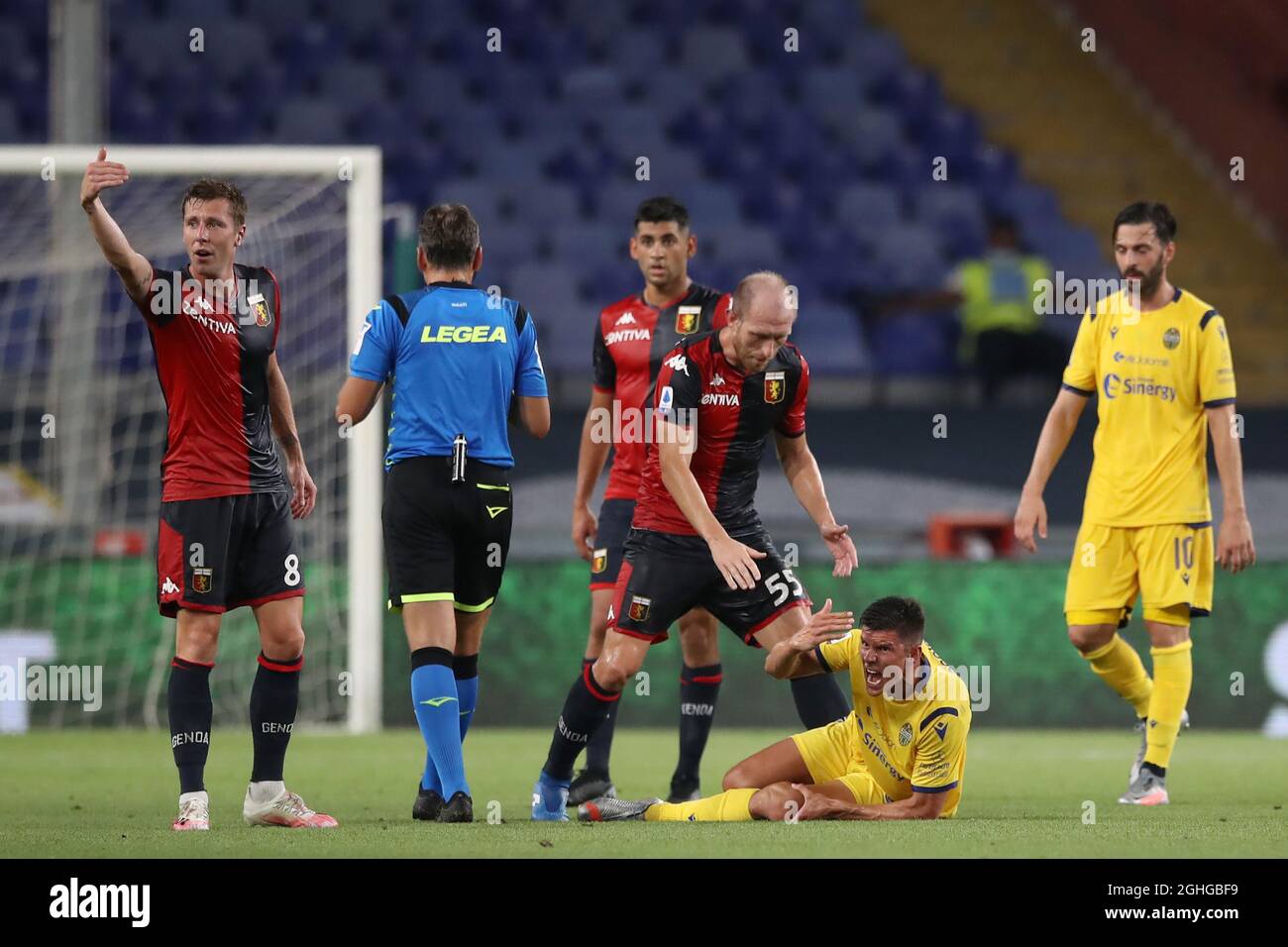 Matteo Pessina of Hellas Verona writhes in agony after dislocating his patella in a challenge with Cristian Romero of Genoa CFC whom was subsequently booked during the Serie A match at Luigi Ferraris, Genoa. Picture date: 2nd August 2020. Picture credit should read: Jonathan Moscrop/Sportimage via PA Images Stock Photo