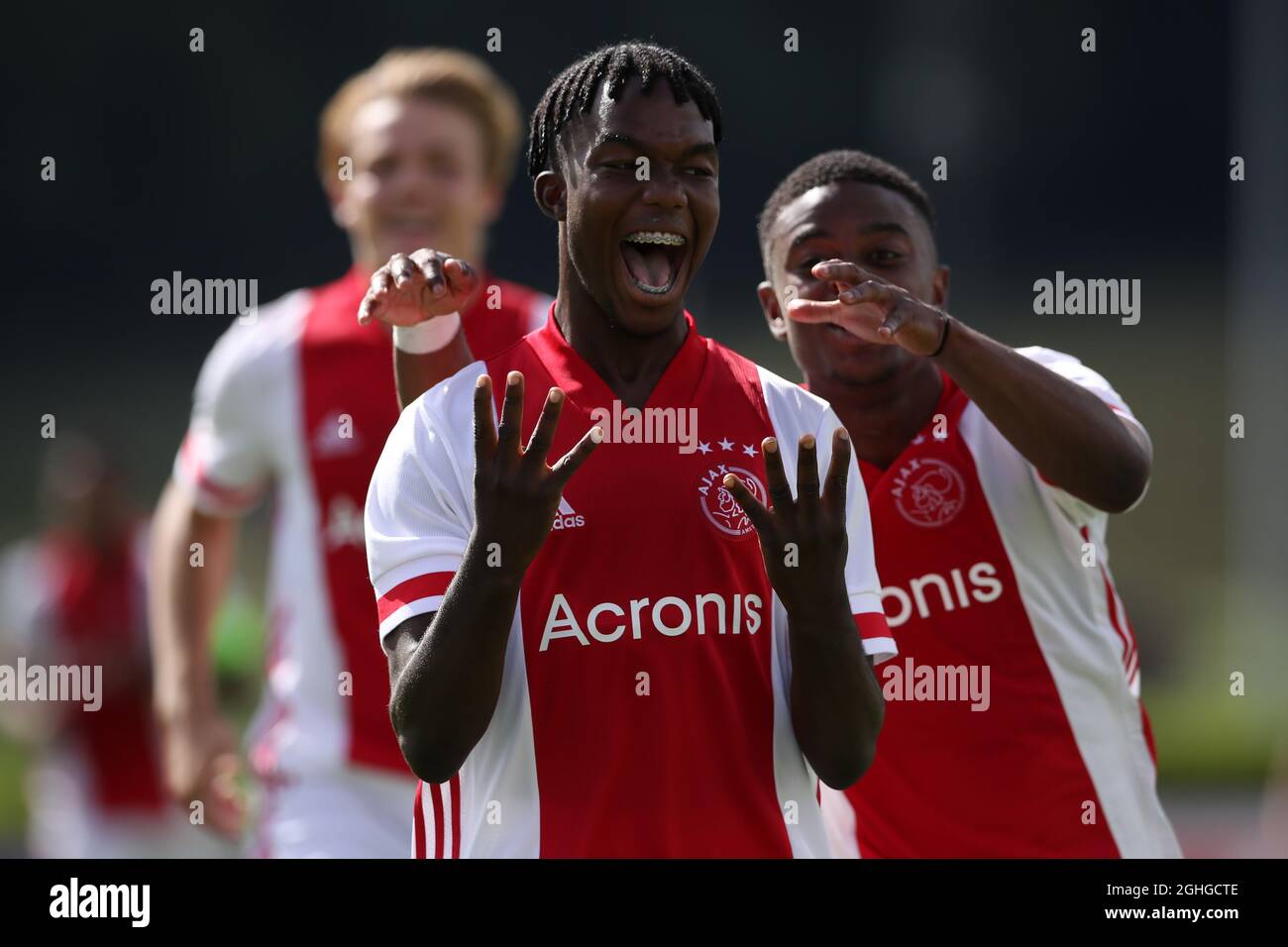 Joel Ideho of Ajax celebrates with team mates Sontje Hansen and Christian Rasmussen after scoring to give the side a 3-0 lead during the UEFA Youth League match at Colovray Sports Centre, Nyon. Picture date: 18th August 2020. Picture credit should read: Jonathan Moscrop/Sportimage via PA Images Stock Photo