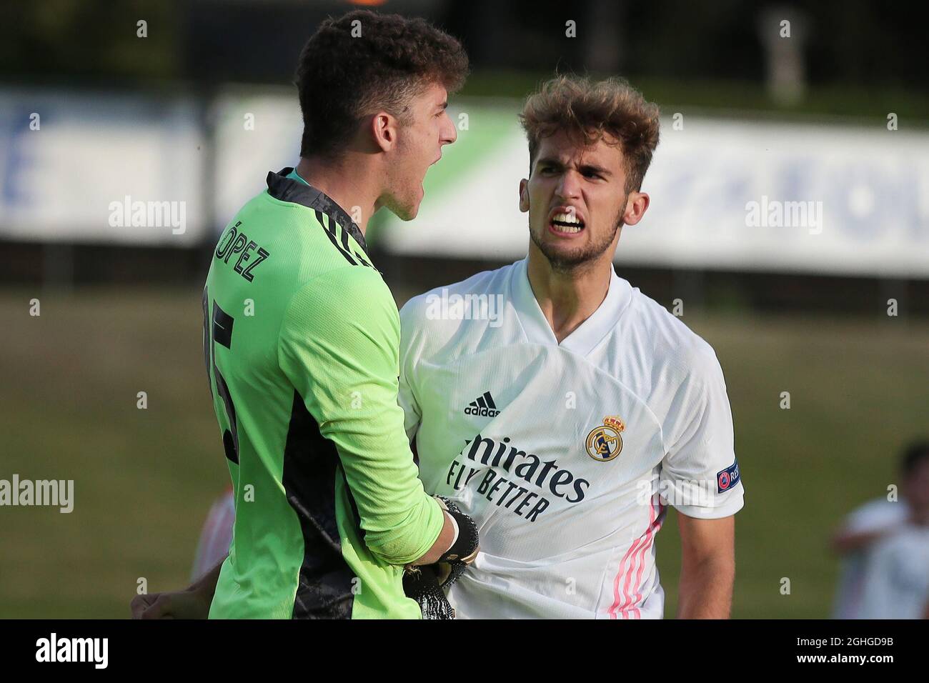 Luis Lopez of Real Madrid celebrates with team mate Pablo Ramon after saving a second half penalty from Tiago Dantas of Benfica during the UEFA Youth League match at Colovray Sports Centre, Nyon. Picture date: 25th August 2020. Picture credit should read: Jonathan Moscrop/Sportimage via PA Images Stock Photo