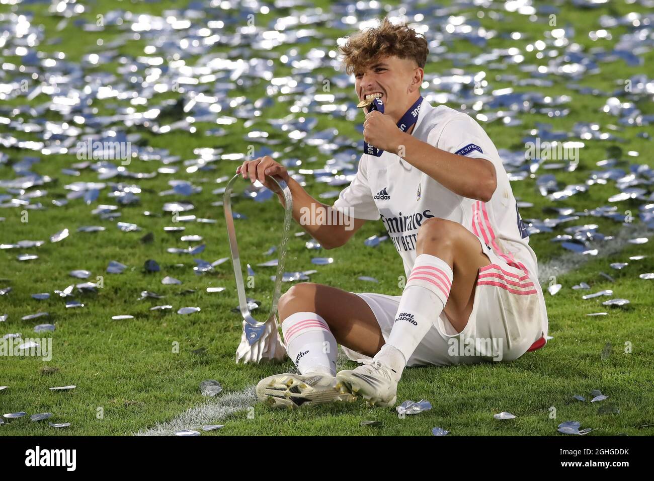 Pablo Rodriguez of Real Madrid celebrates biting his winners' medal and  holding the trophy following the UEFA Youth League match at Colovray Sports  Centre, Nyon. Picture date: 25th August 2020. Picture credit