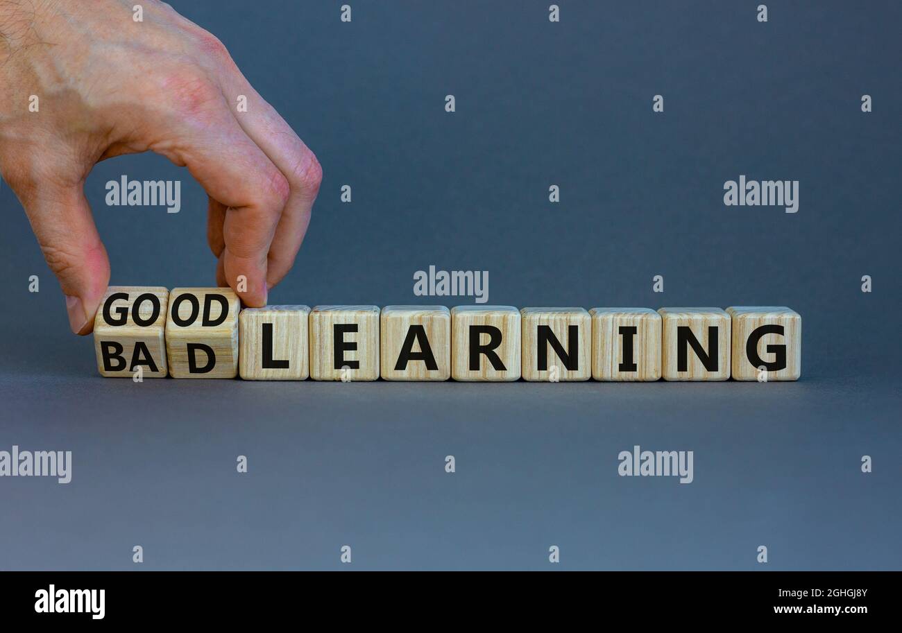 Good or bad learning symbol. Businessman turns cubes, changes words ...