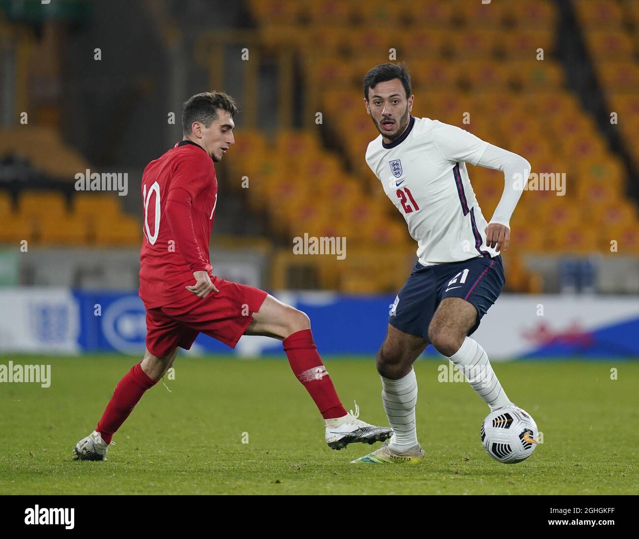Dwight Marshall of England and Ravil Tagir of Turkey during the UEFA Euro U21 Qualifying match at Molineux, Wolverhampton. Picture date: 13th October 2020. Picture credit should read: Andrew Yates/Sportimage via PA Images Stock Photo