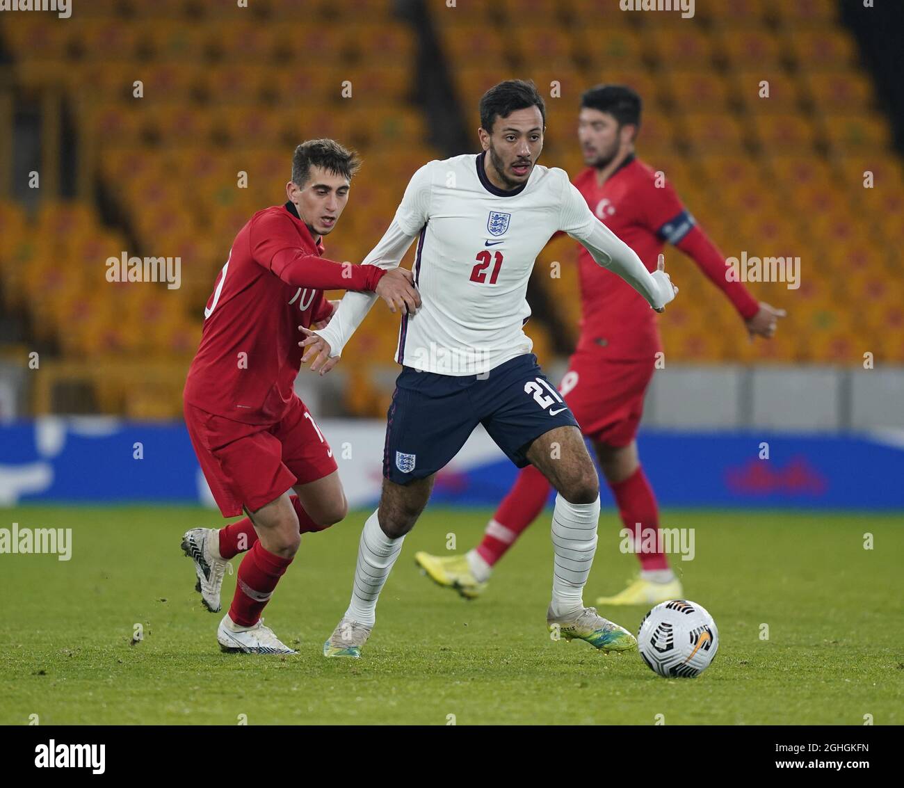 Dwight Marshall of England and Ravil Tagir of Turkey during the UEFA Euro U21 Qualifying match at Molineux, Wolverhampton. Picture date: 13th October 2020. Picture credit should read: Andrew Yates/Sportimage via PA Images Stock Photo