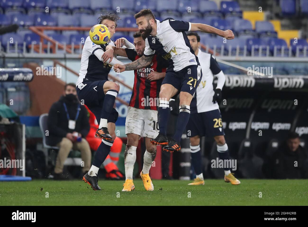 Albin Ekdal and Lorenzo Tonelli of UC Sampdoria overpower Hakan Calhanoglu of AC Milan to win the ball during the Serie A match at Luigi Ferraris, Genoa. Picture date: 6th December 2020. Picture credit should read: Jonathan Moscrop/Sportimage via PA Images Stock Photo