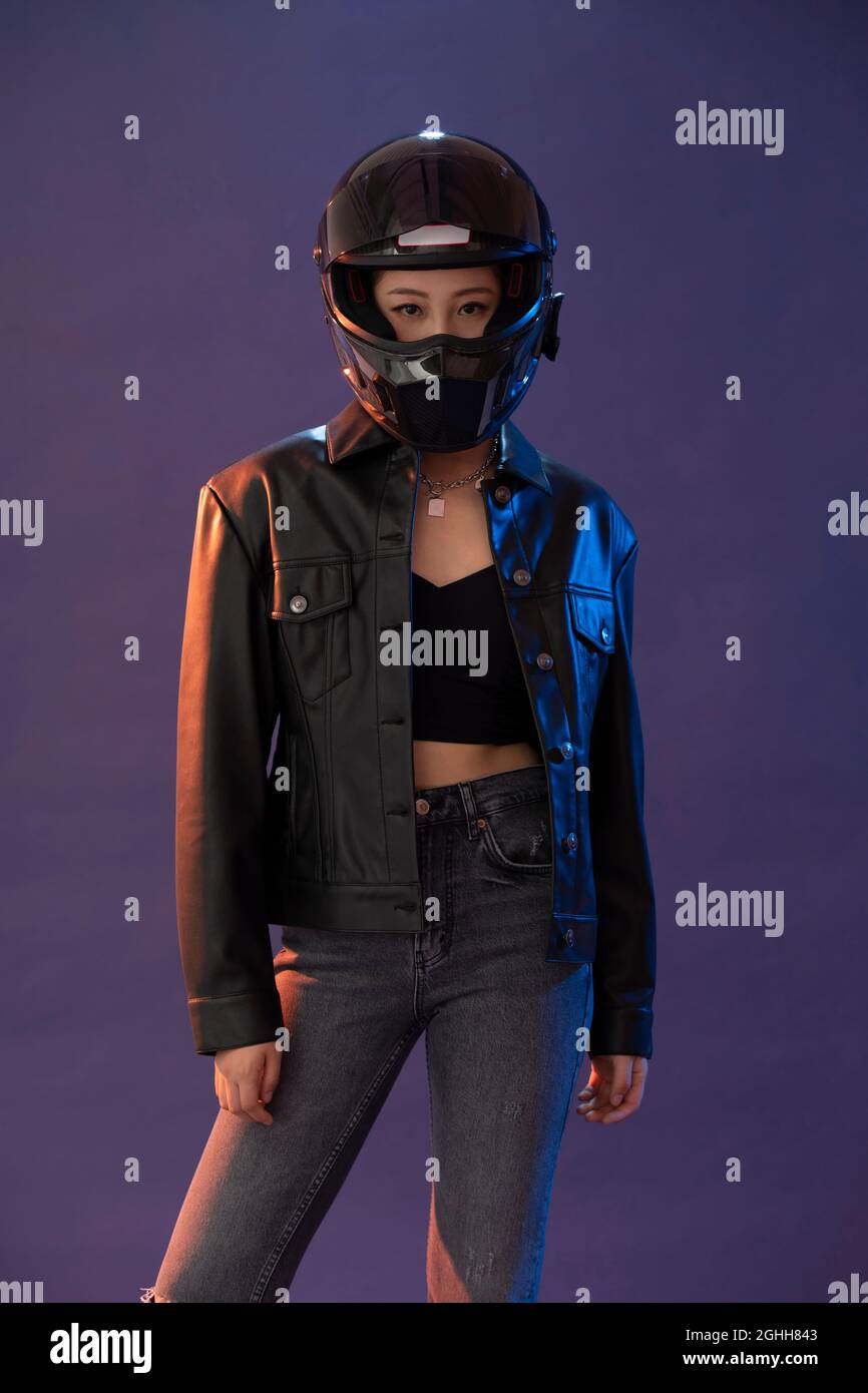Young woman with a helmet Stock Photo - Alamy