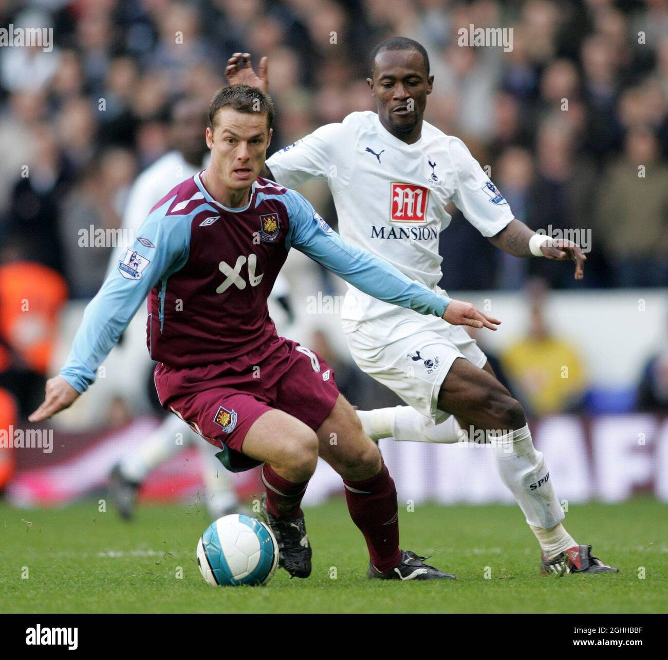 Tottenham's Didier Zokora tussles with West Ham's Scott Parker during the Barclays Premier League match between Tottenham Hotspur and West Ham United at White Hart Lane in London, England. Stock Photo