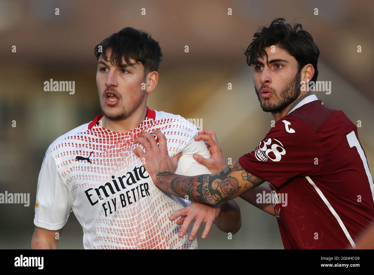 Denis Portanova of Torino FC Gets to grips with Riccardo Tonin of AC Milan  during the Primavera 1 match at Stadio Comunale di Volpiano, Volpiano.  Picture date: 27th January 2021. Picture credit