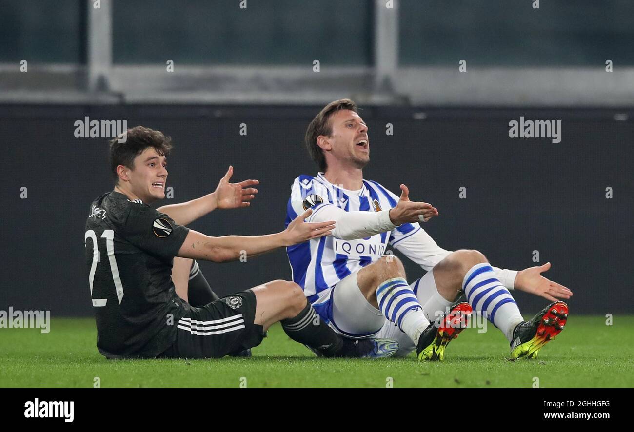 Daniel James of Manchester United complains alongside Nacho Monreal of Real Sociedad during the UEFA Europa League match at Juventus Stadium, Turin. Picture date: 18th February 2021. Picture credit should read: Jonathan Moscrop/Sportimage via PA Images Stock Photo