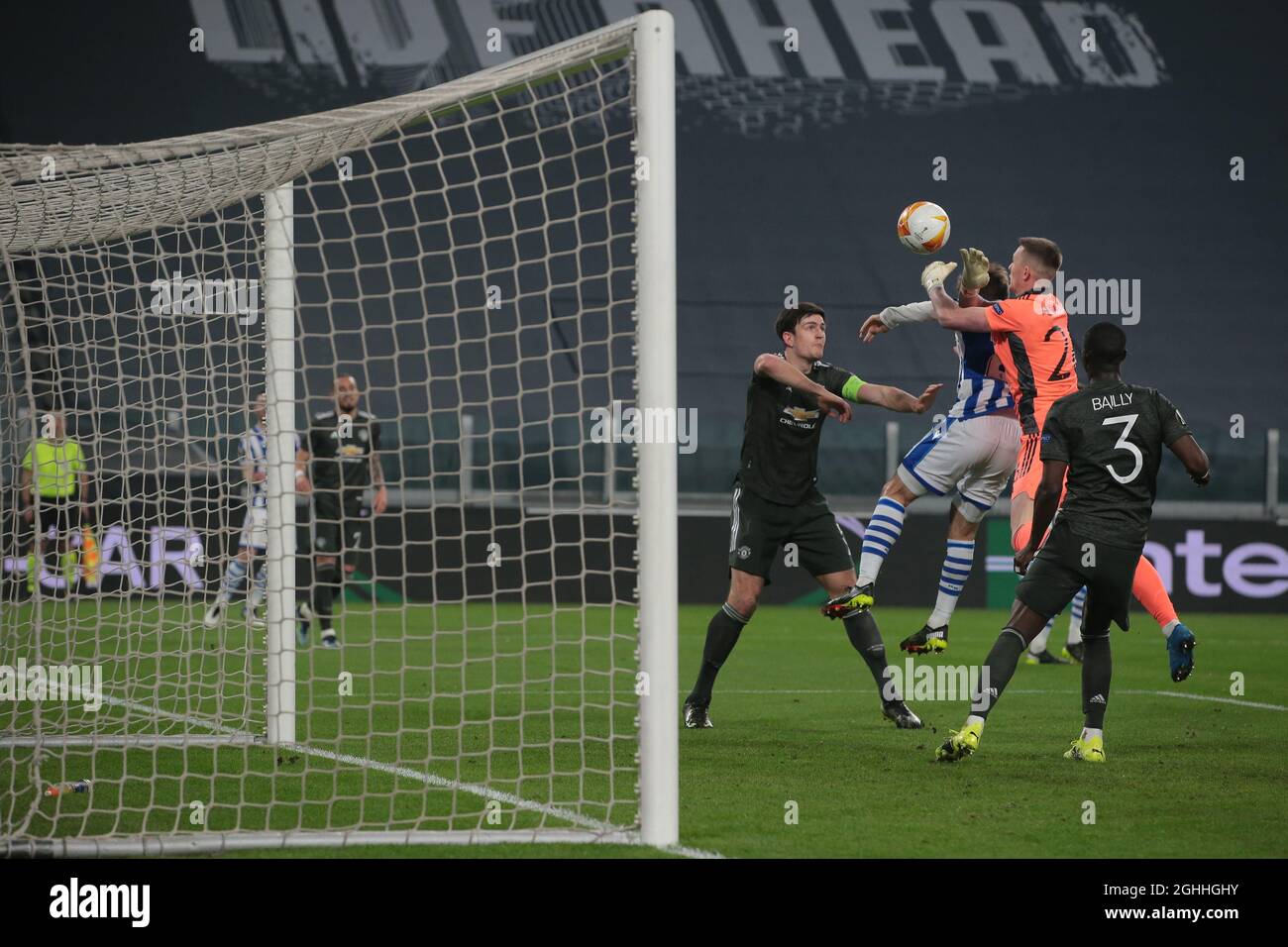 Nacho Monreal of Real Sociedad clashes with Dean Henderson of Manchester United as Harry Maguire of Manchester United looks on during the UEFA Europa League match at Juventus Stadium, Turin. Picture date: 18th February 2021. Picture credit should read: Jonathan Moscrop/Sportimage via PA Images Stock Photo
