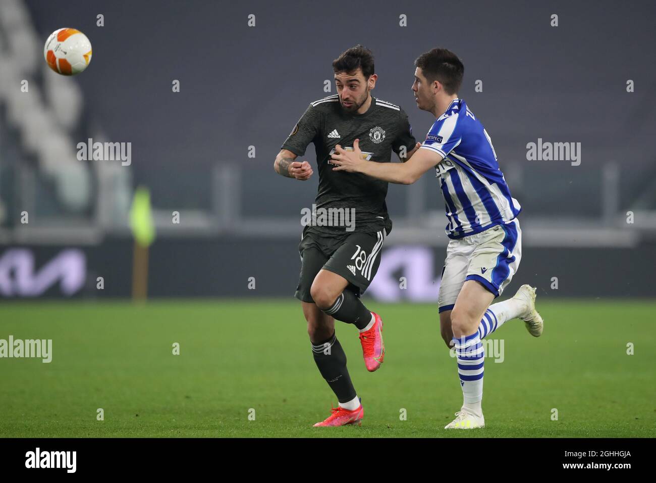 Bruno Fernandes of Manchester United and Igor Zubeldia of Real Sociedad battle for possession during the UEFA Europa League match at Juventus Stadium, Turin. Picture date: 18th February 2021. Picture credit should read: Jonathan Moscrop/Sportimage via PA Images Stock Photo