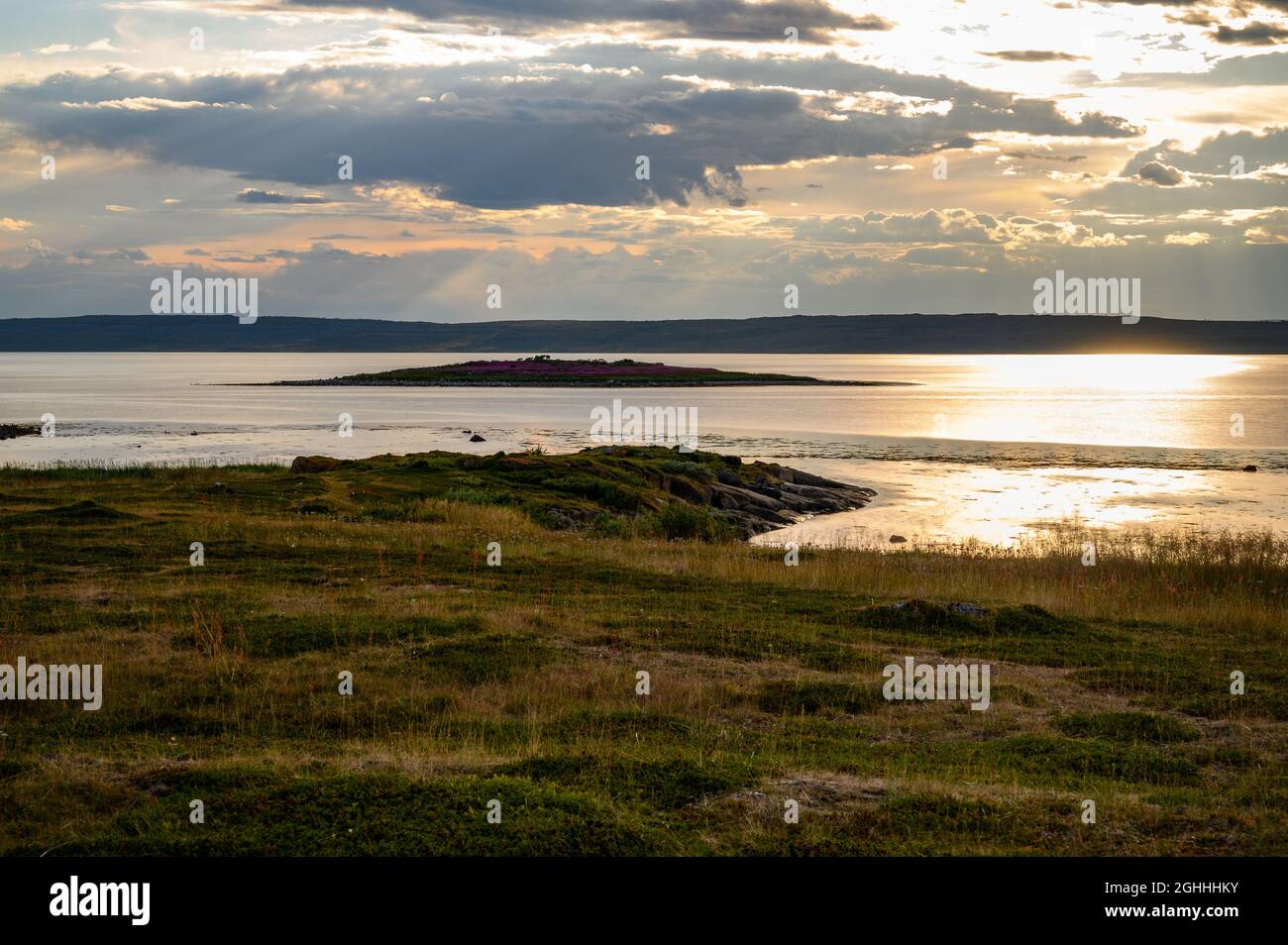 Clouds above the Varanger fjord in Nesseby, Finnmark, Norway. Stock Photo