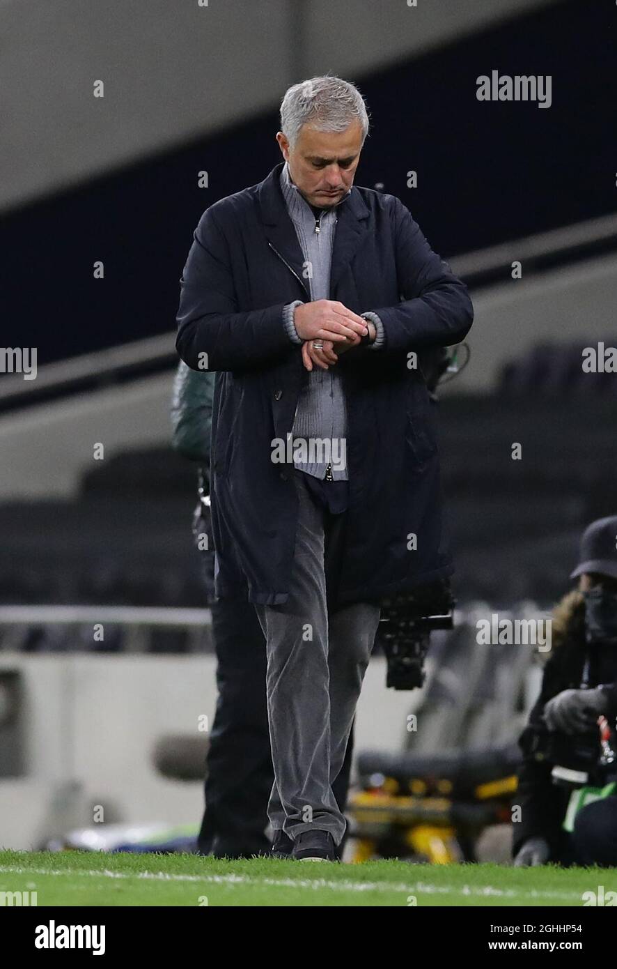 Jose Mourinho manager of Tottenham checks his watch during the UEFA Europa  League match at the