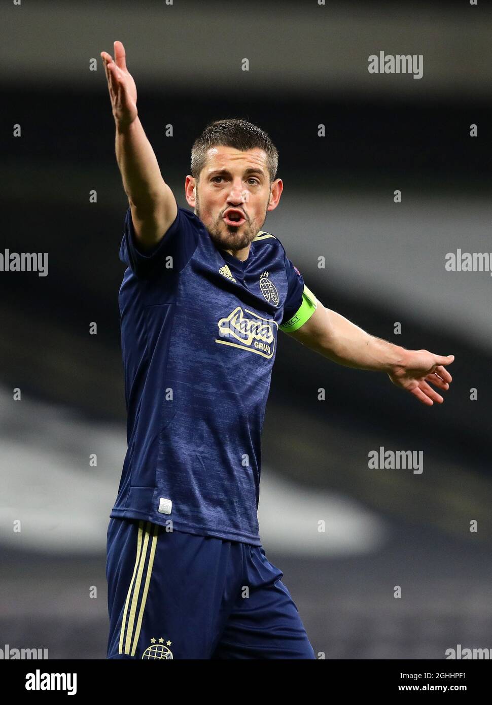 BUDAPEST, HUNGARY - AUGUST 13: (l-r) Tokmac Chol Nguen of Ferencvarosi TC  wins the ball from Arijan Ademi of GNK Dinamo Zagreb during the UEFA  Champions League Third Qualifying Round match between