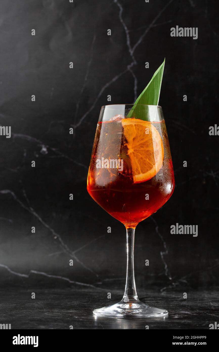 Glass of ice cold Aperol spritz cocktail served in a wine glass ...