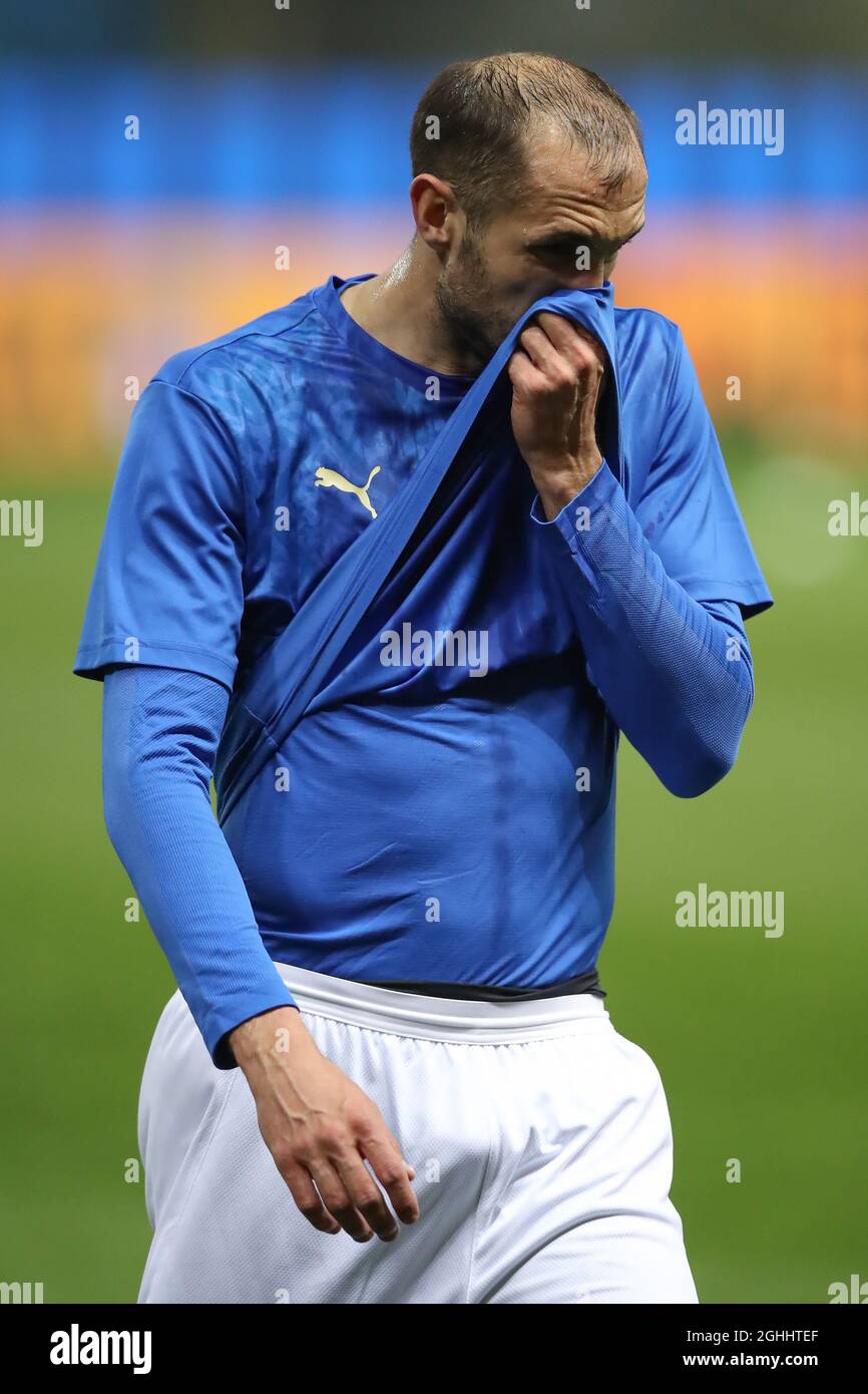 Giorgio Chiellini of Italy wipes his face with his jersey during the warm up prior to the Fifa World Cup qualifiers match at Stadio Ennio Tardini, Parma. Picture date: 25th March 2021. Picture credit should read: Jonathan Moscrop/Sportimage via PA Images Stock Photo