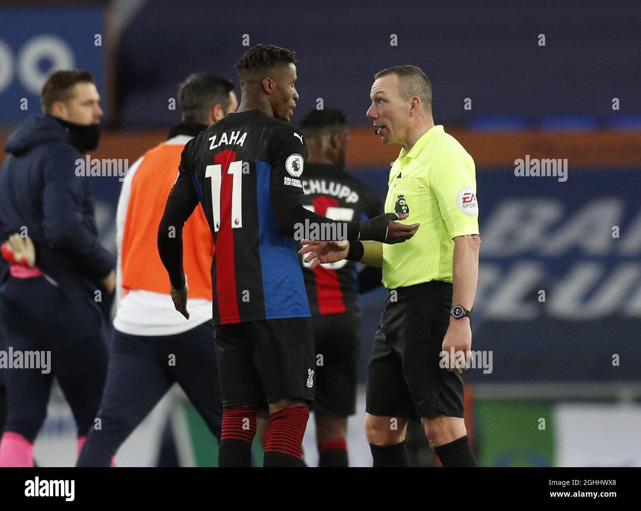 Liverpool, UK, 5th April 2021. Referee Kevin Friend has words with Wilfried Zaha of Crystal Palace after he clashed with Ben Godfrey of Everton on the final whistle during the Premier League match at Goodison Park, Liverpool. Picture date: 5th April 2021. Picture credit should read: Darren Staples/Sportimage via PA Images Stock Photo