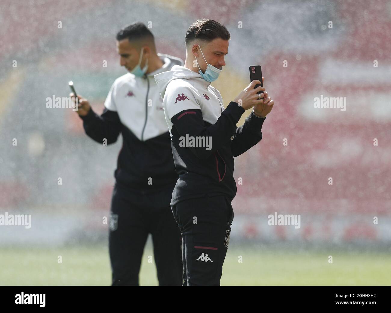 Liverpool, England, 10th April 2021. Matty Cash of Aston Villa takes pictures with his phone as he walks on the pitch before the Premier League match at Anfield, Liverpool. Picture credit should read: Darren Staples / Sportimage via PA Images Stock Photo