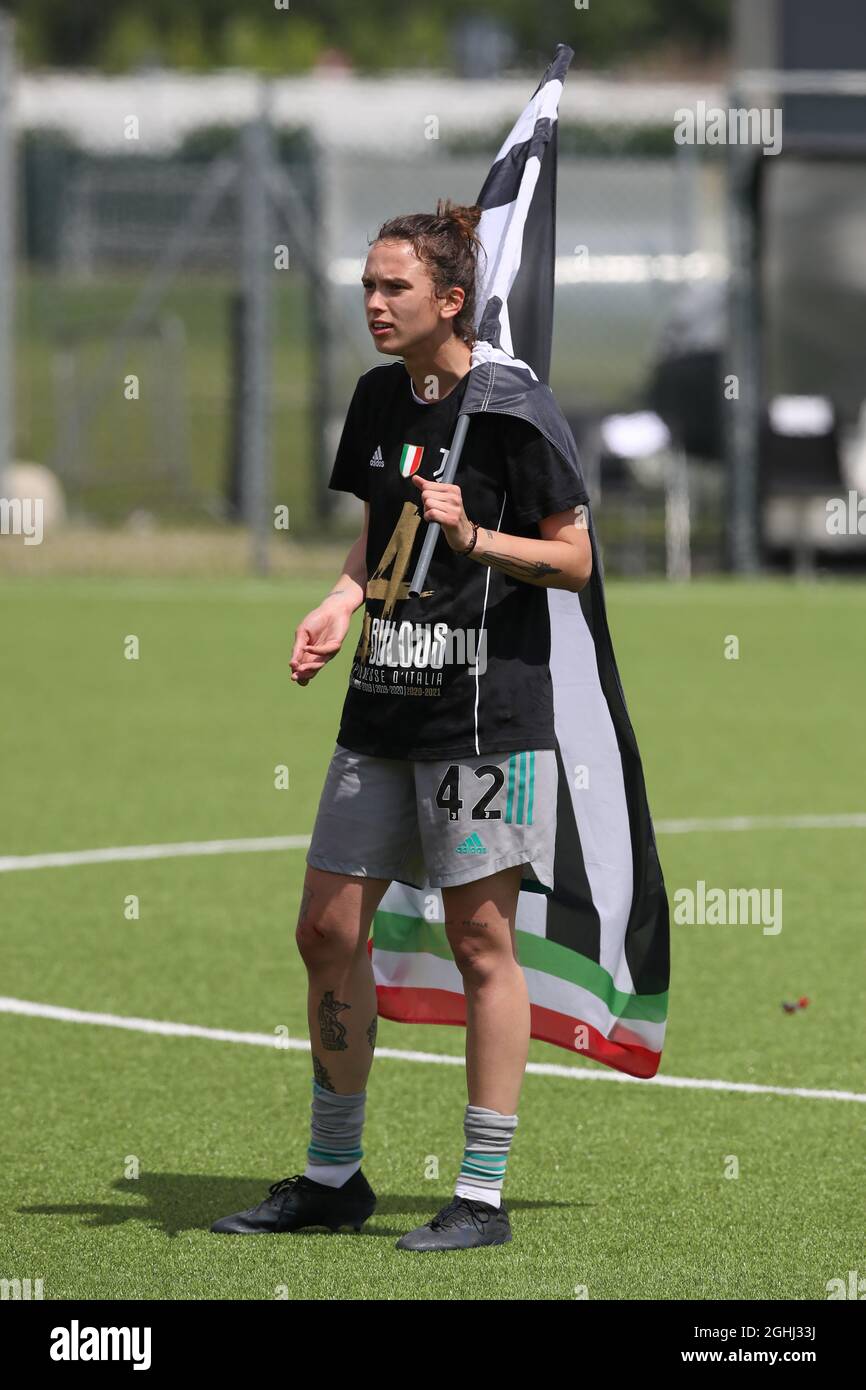 Turin, Italy, 8th May 2021. Doris Bacic of Juventus holds a giant flag as she celebrates the club's fourth consecutive Women's title following the final whistle of the Serie A Femminile match at Juventus Training Centre, Turin. Picture credit should read: Jonathan Moscrop / Sportimage via PA Images Stock Photo