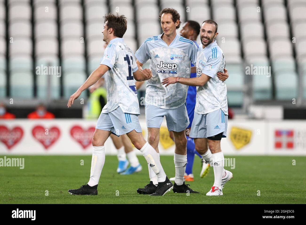 Turin, Italy, 25th May 2021. John Elkann CEO of Exor celebrates with  Ferrari Formula One Pilot Charles Leclerc and Giovanni Di Stefano Adidas  Football Sports Marketing Manager during the Charity Match match