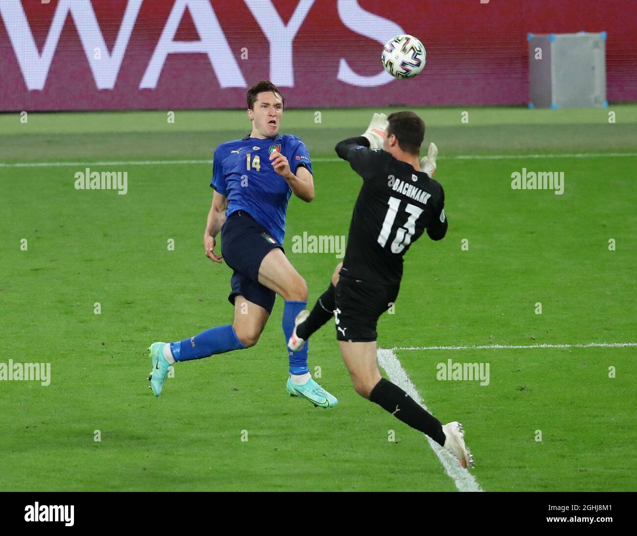 London, England, 26th June 2021.  Federico Chiesa of Italy attempts to chip Daniel Bachmann of Austria during the UEFA European Championships match at Wembley Stadium, London. Picture credit should read: David Klein / Sportimage via PA Images Stock Photo