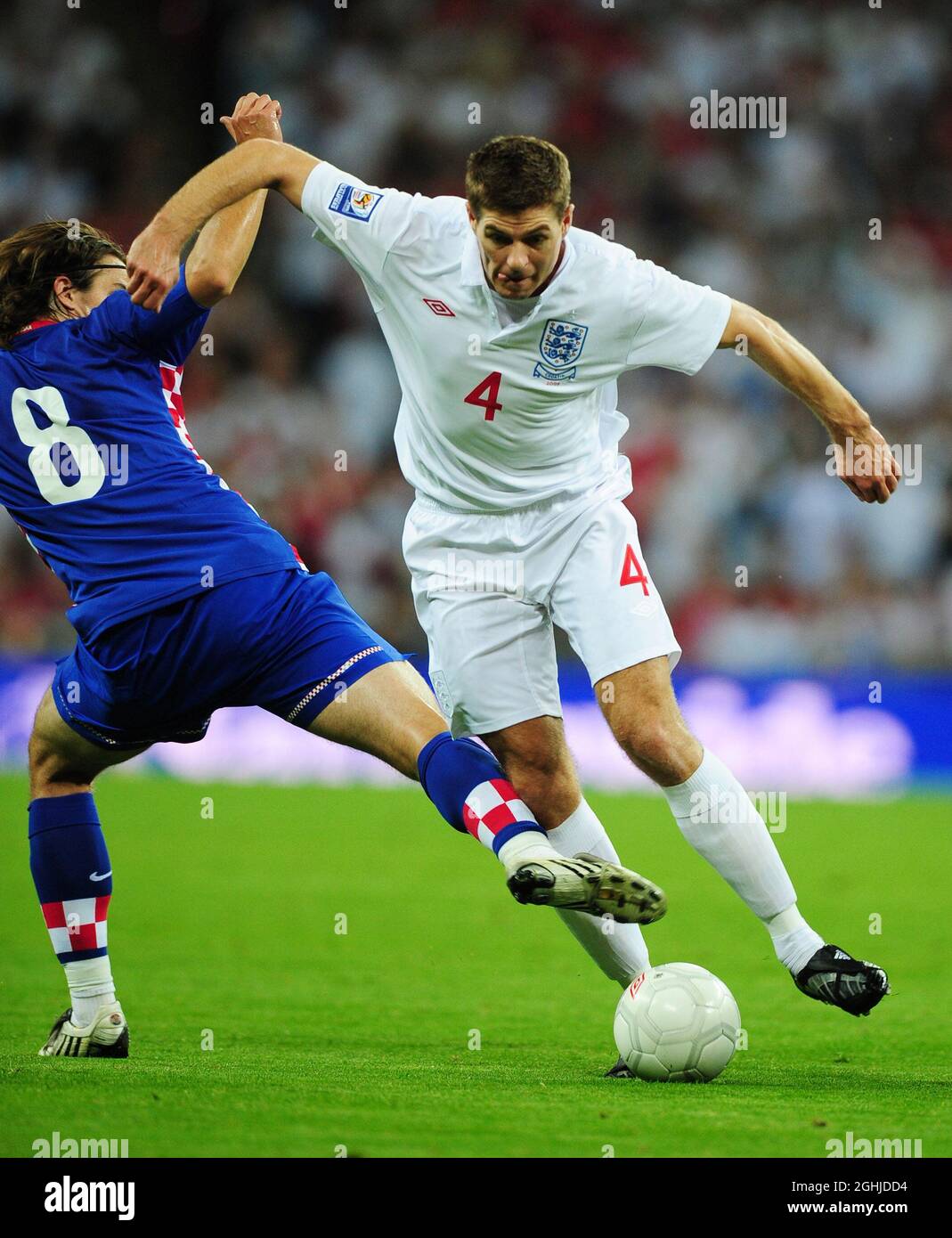 Steven Gerrard of England goes past Niko Kranjcar of Croatia during the World Cup European Qualifier match at Wembley Stadium, London. Stock Photo