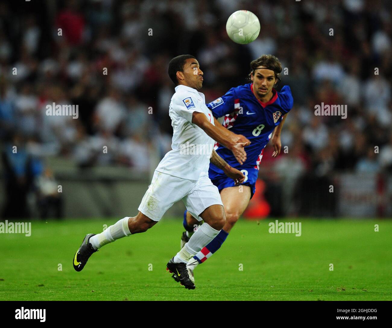 Aaron Lennon of England glides past Niko Kranjcar of Croatia during the World Cup European Qualifier match at Wembley Stadium, London. Stock Photo