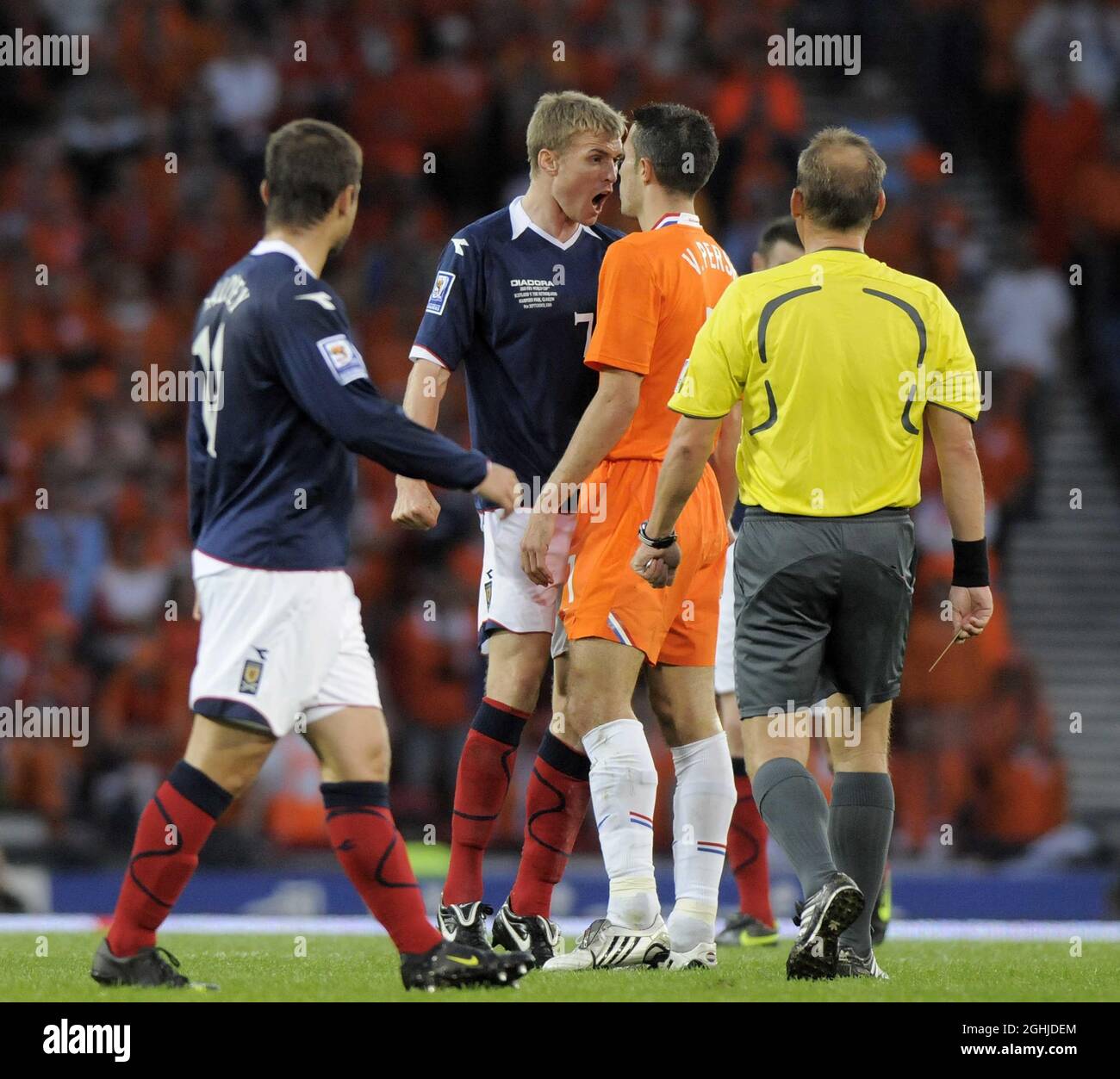 Scotland's Darren Fletcher squares up to Holland's Robin van Persie after a foul during the World Cup European Qualifier match at Hampden Park, Glasgow. Stock Photo