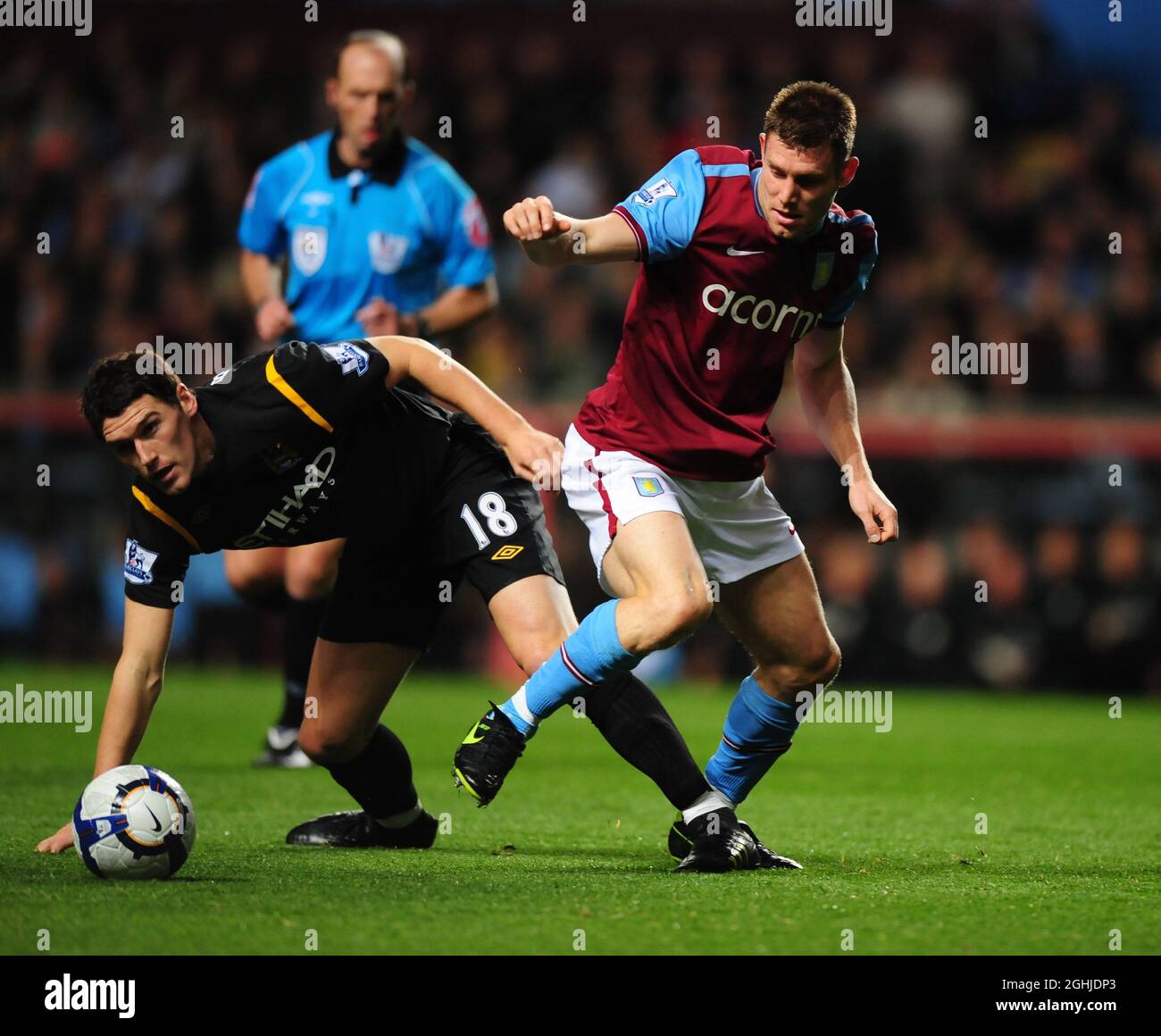 Gareth Barry of Manchester City challenges James Milner of Aston Villa during the Barclays Premier League match between Aston Villa v Manchester City at Villa Park in Birmingham. Stock Photo