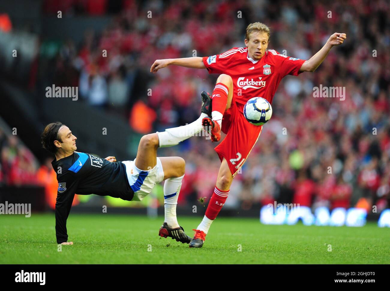 Dimitar Berbatov of Manchester United and Lucas of Liverpool during the Barclays Premier League match between Liverpool v Manchester United at Anfield, Liverpool. Stock Photo
