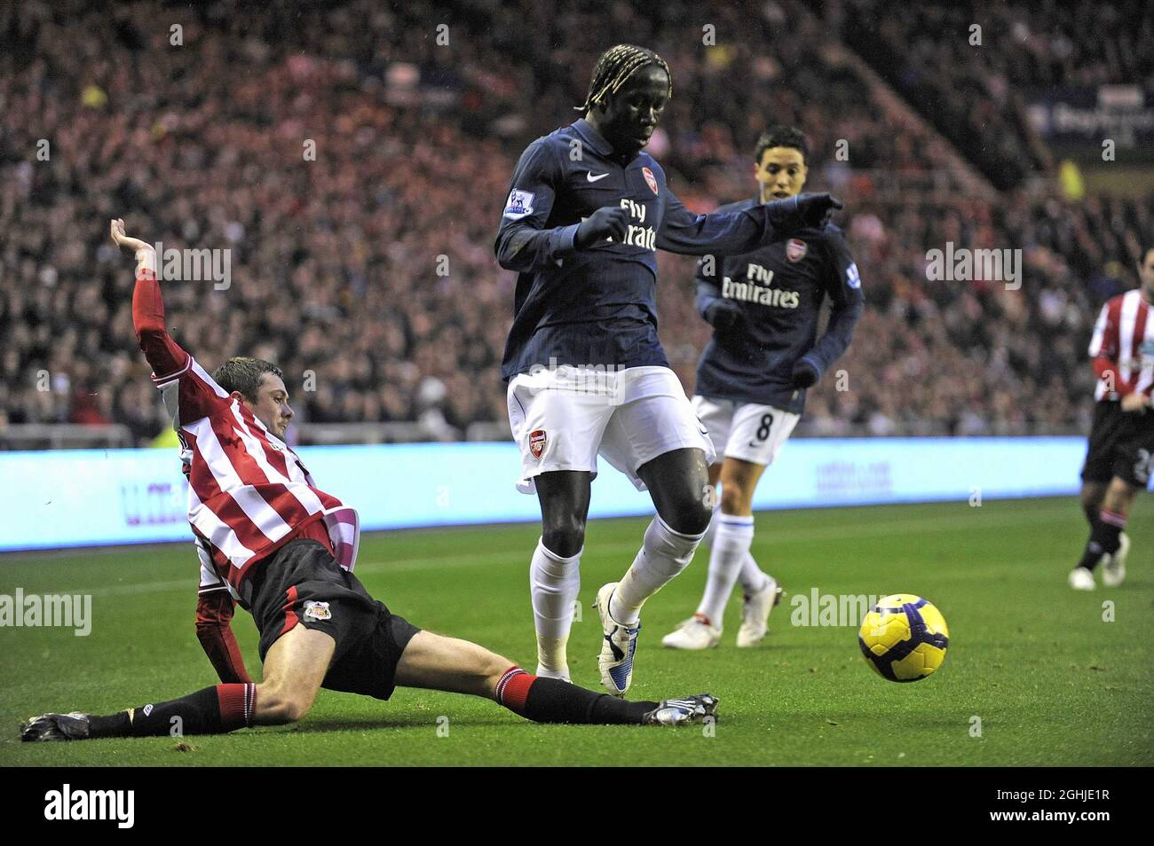 Sunderland's George McCartney and Arsenal's Bacary Sagna during Barclays Premier League match between Sunderland and Arsenal at Stadium of Light in Sunderland. Stock Photo