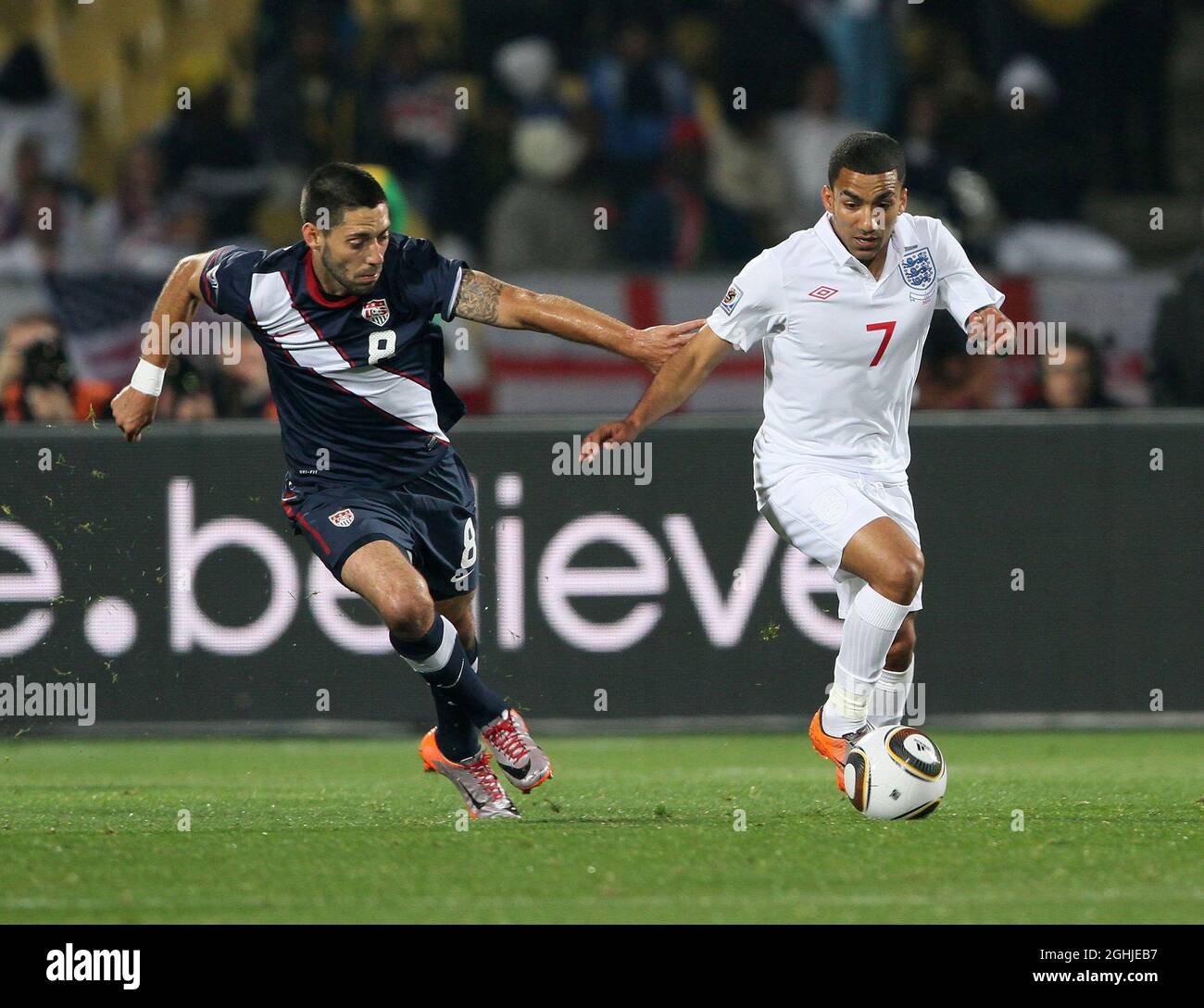 England's Aaron Lennon tussles with USA's Clint Dempsey during the FIFA World Cup 2010, Group C match between England v USA at Royal Bafokeng Stadium, Rustenburg, South Africa. Stock Photo