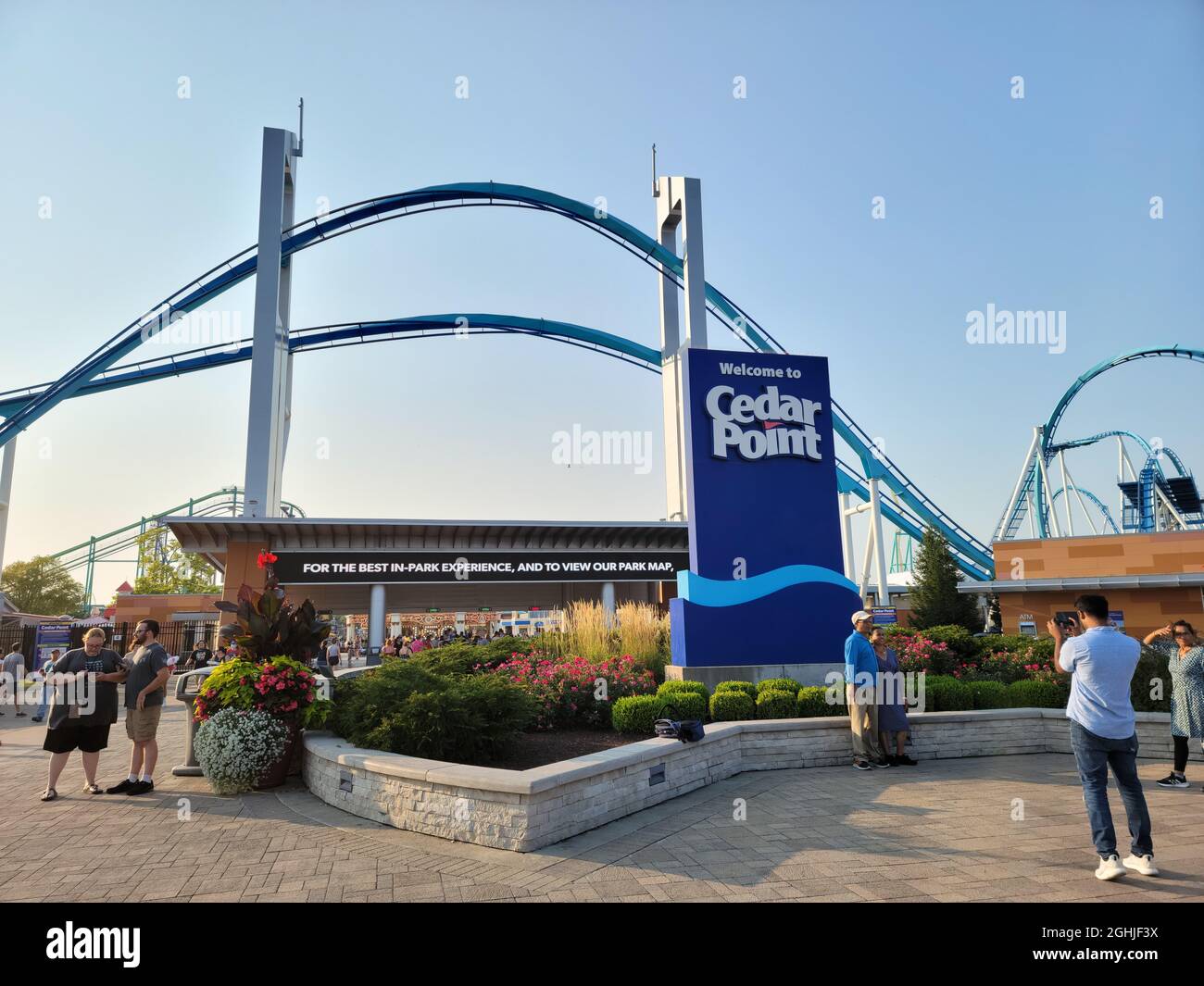 The entrance of Cedar Point with the Gatekeeper ride over the top in the evening with a sunset. Stock Photo