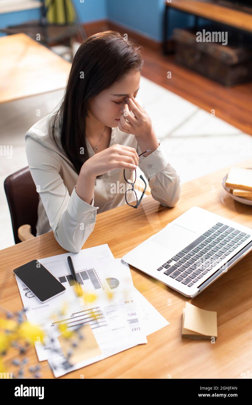 Young woman working with laptop at home Stock Photo - Alamy