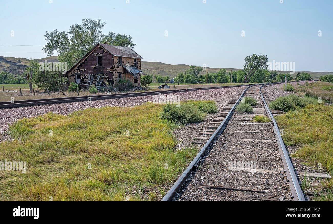 Railroad track and abandoned building in the ghost town of Owanka