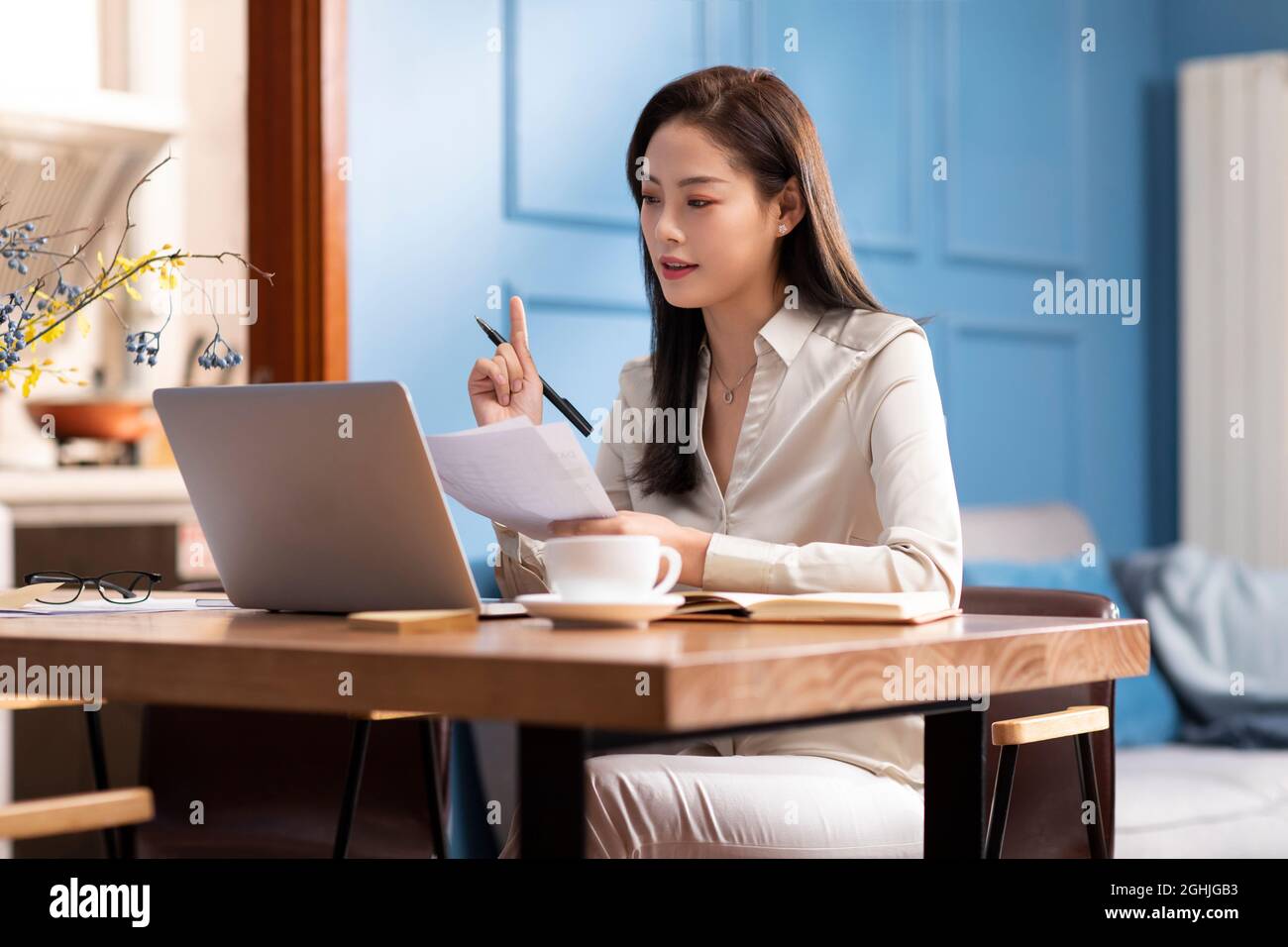 Young woman working with laptop at home Stock Photo - Alamy
