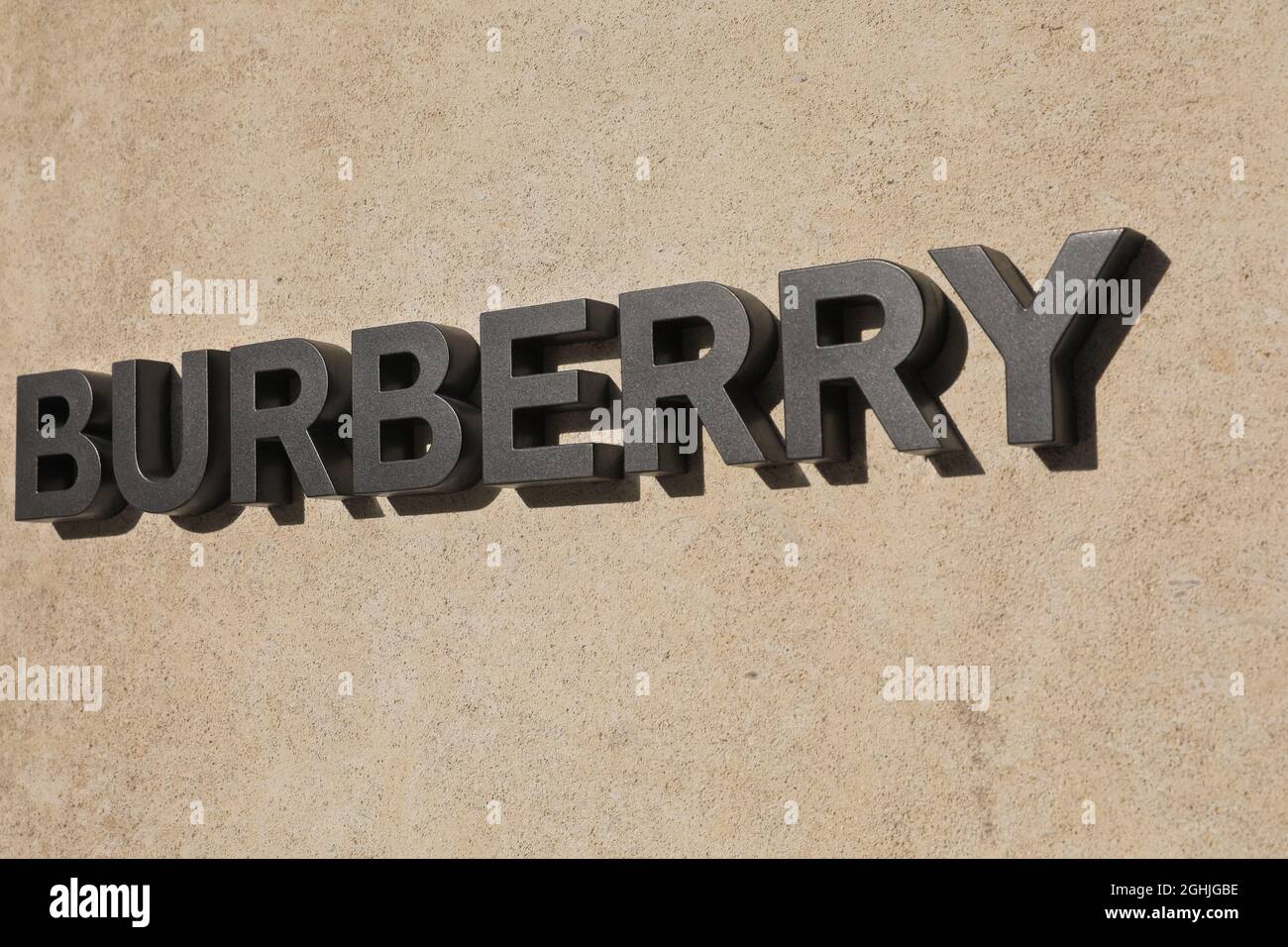 Burberry name brand logo and sign outside store in Bond Street, Mayfair, London, England, UK Stock Photo
