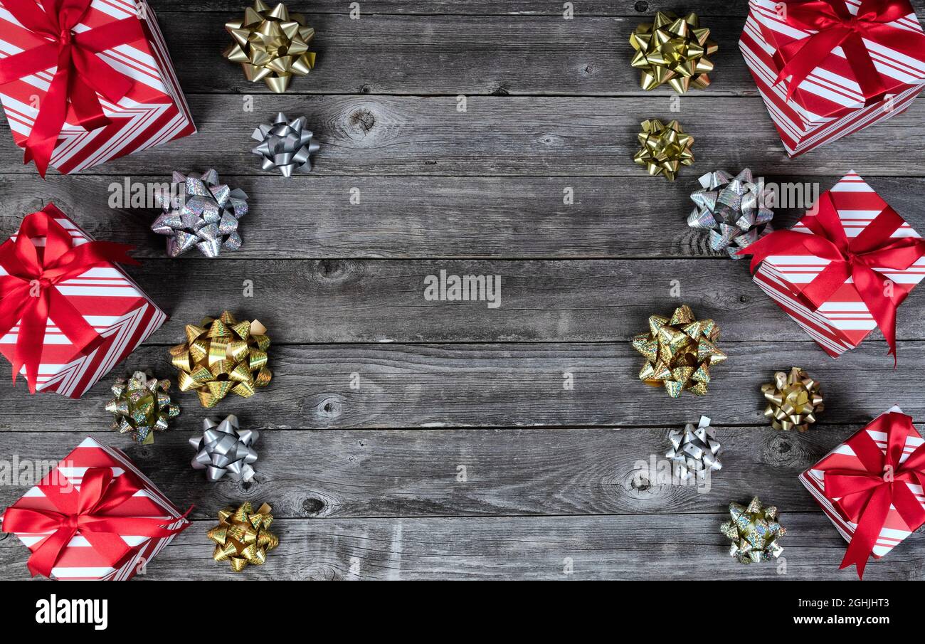 Gift boxes and bow ribbon decorations on rustic wooden planks for a ...