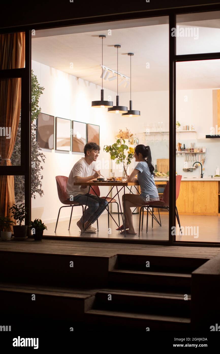 Happy young couple enjoying dinner Stock Photo