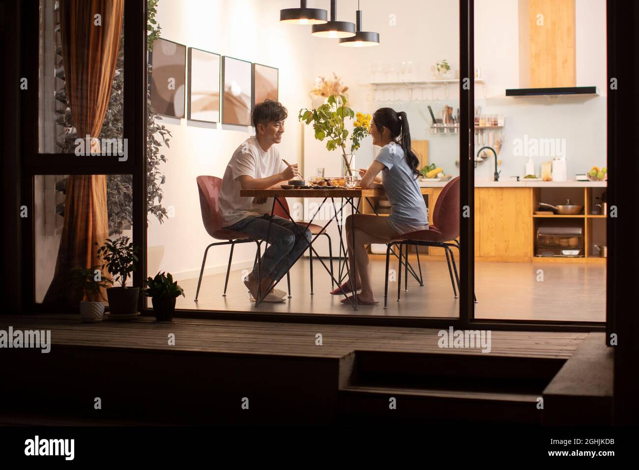 Happy young couple enjoying dinner Stock Photo