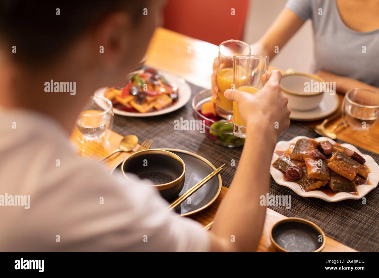 Happy young couple enjoying dinner Stock Photo