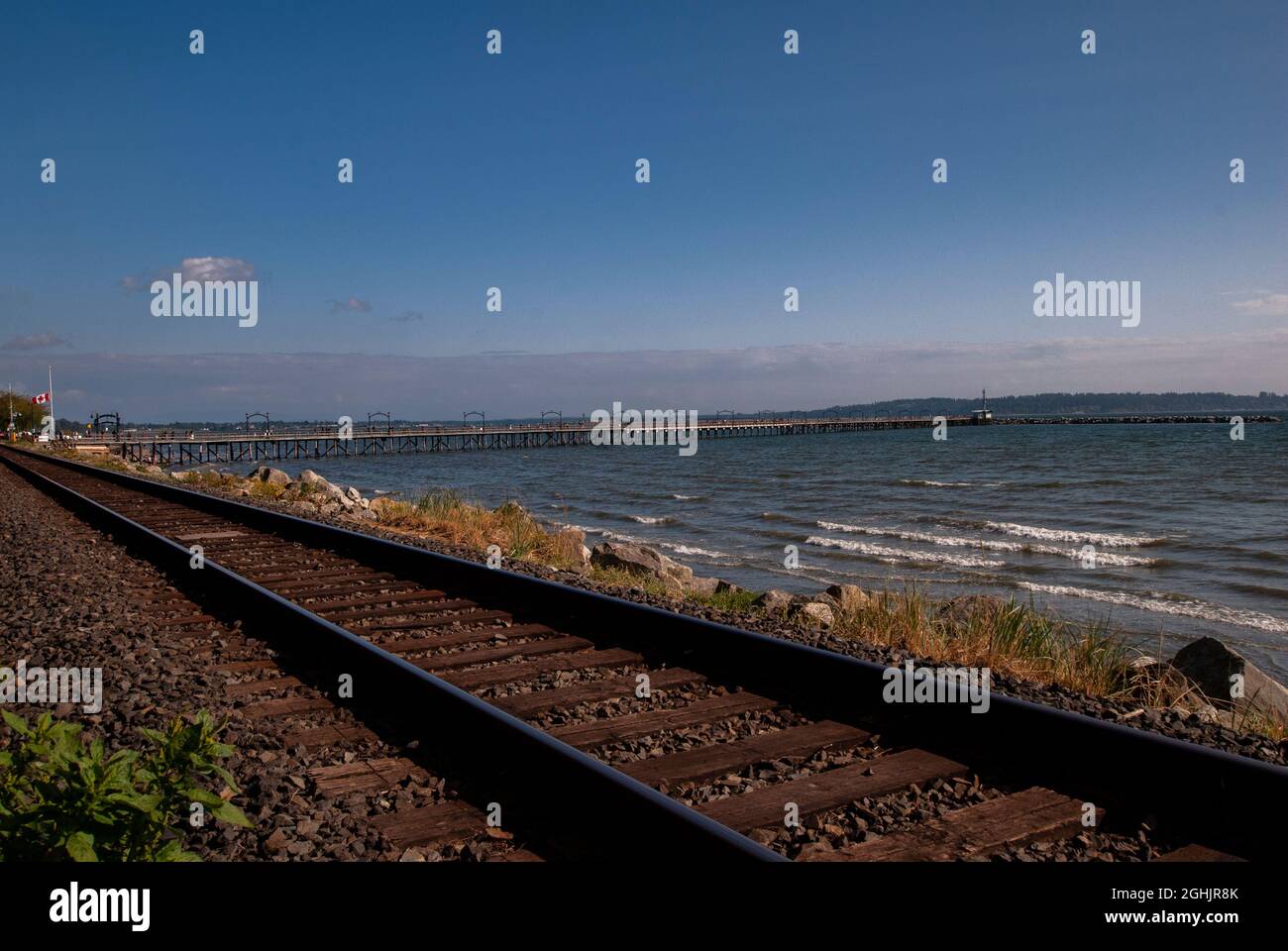 Train tracks running through White Rock, British Columbia, Canada Stock Photo