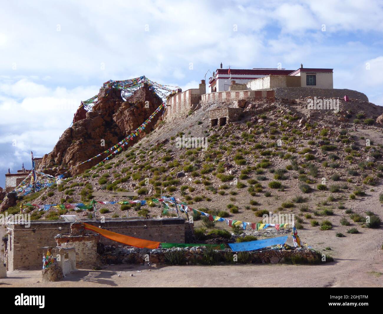 Chiu Gompa, a small Tibetan monastery on the cliffs of a steep red-colored hill by Lake Manasarovar, near Darchen, Mt Kailash base, Tibet Stock Photo