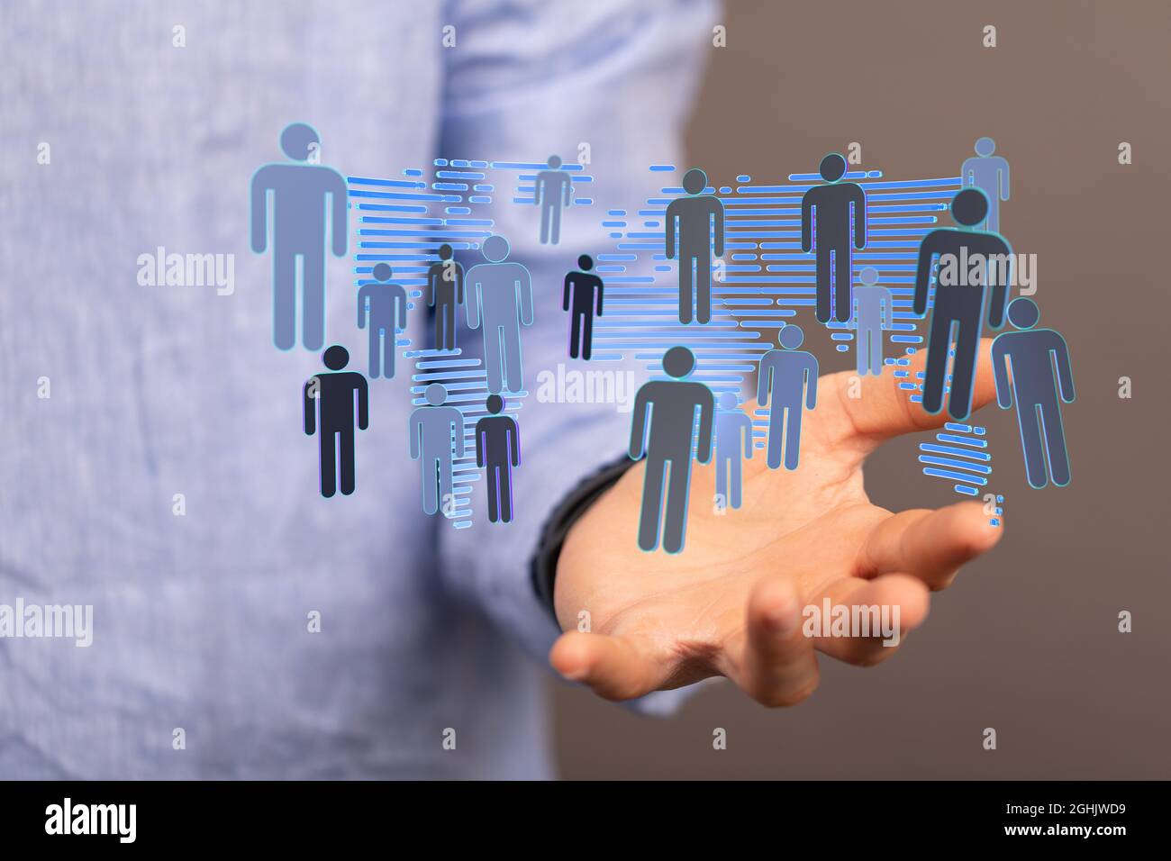 3D rendering of people silhouettes and a world map hovering over a man ...