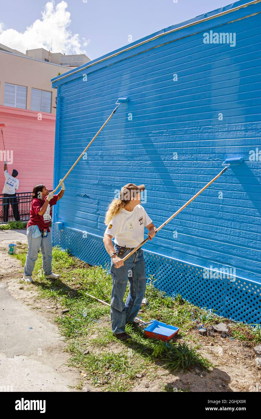 Miami Beach Florida,Hands On HandsOn Miami Day,volunteer volunteers volunteering teamwork,Biscayne Elementary School woman female women painting, Stock Photo