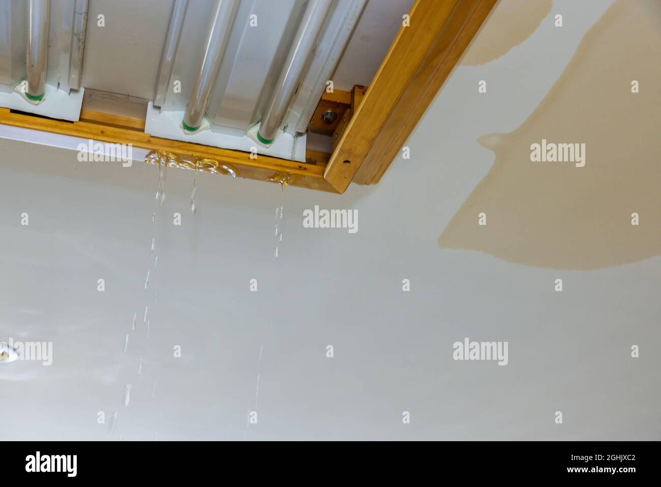 Broken water pipe causes water dripping from ceiling Stock Photo Alamy