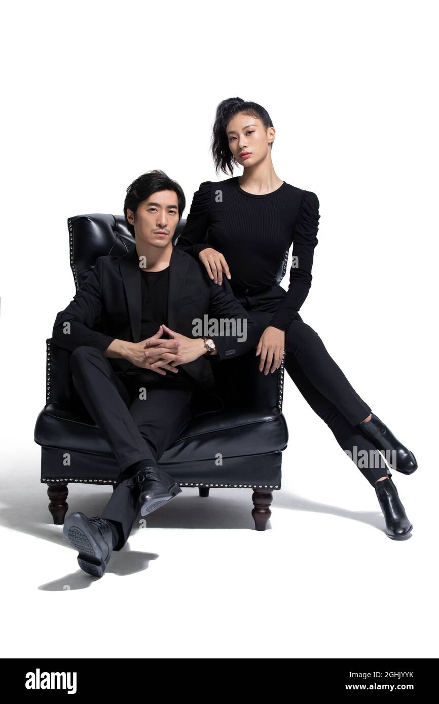 Fashionable couple sitting on a luxury sofa Stock Photo