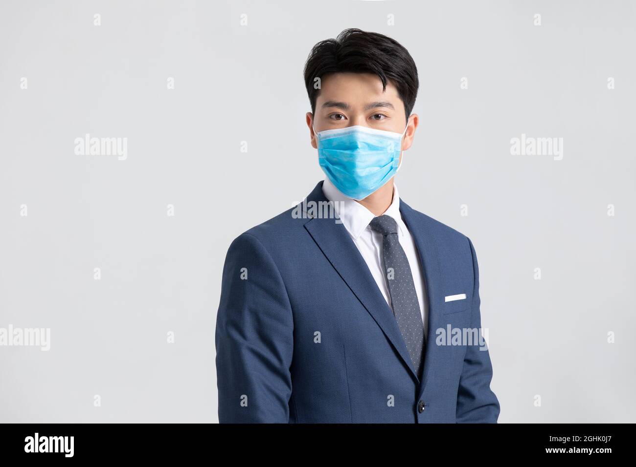 Portrait of businessman wearing surgical mask Stock Photo - Alamy