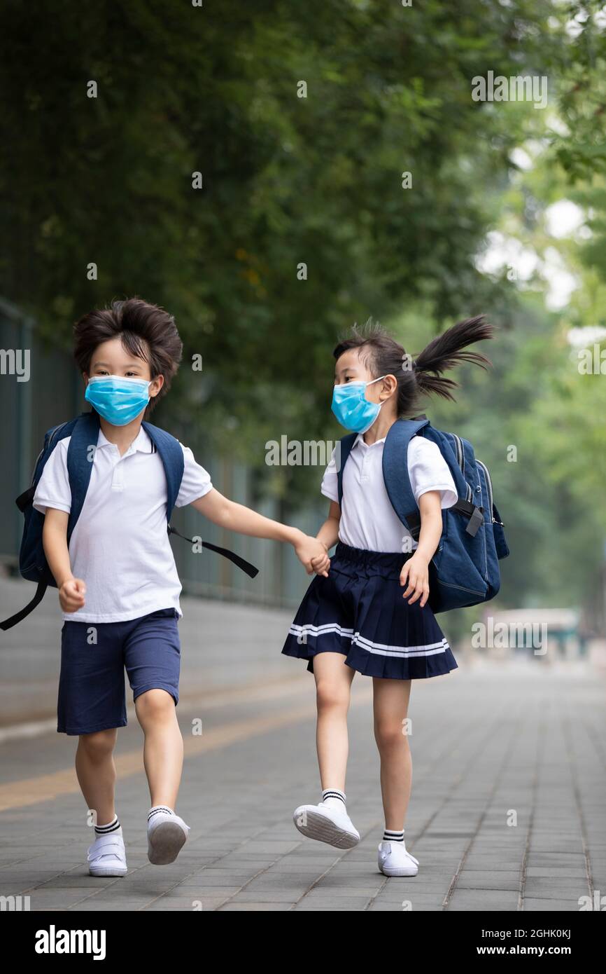 Two girls wearing school uniform hi-res stock photography and images ...
