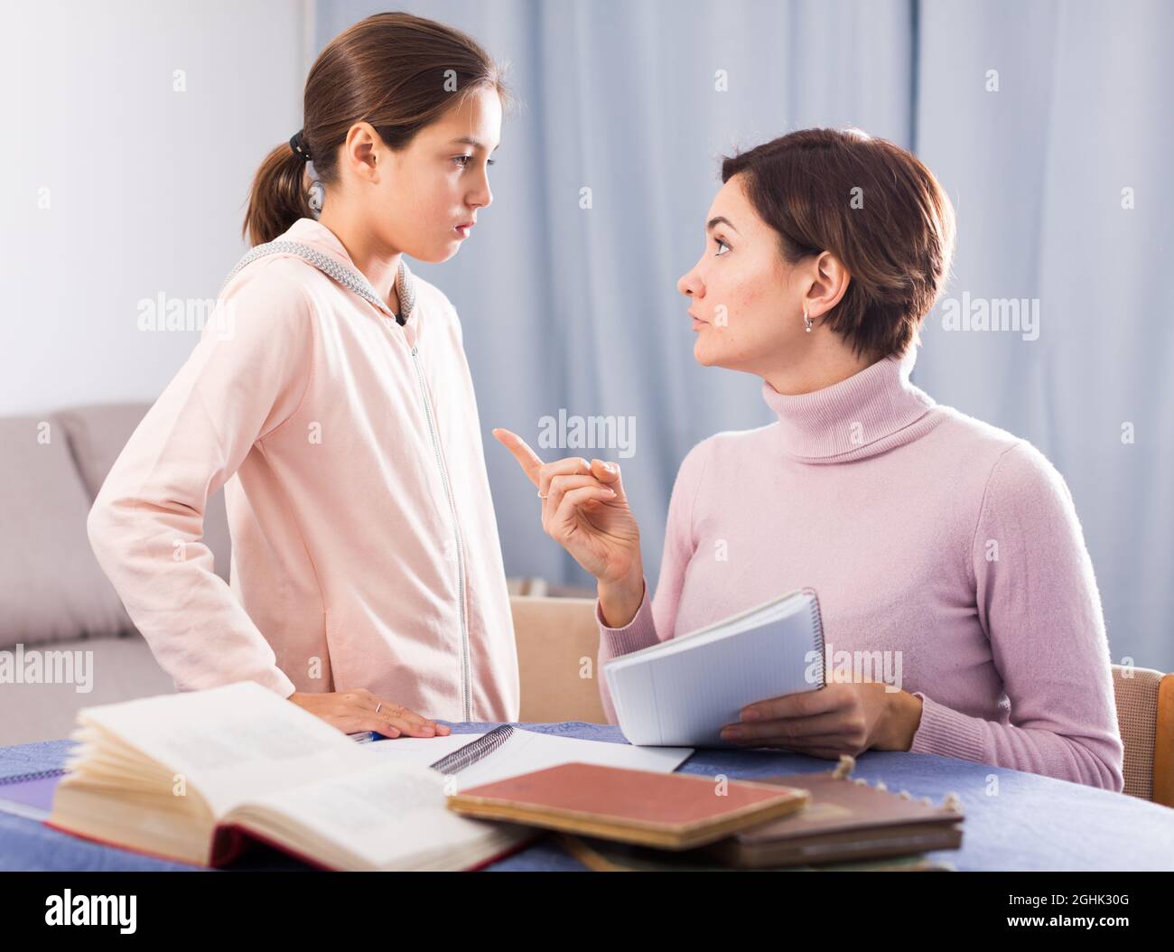 Mother teaches daughter Stock Photo