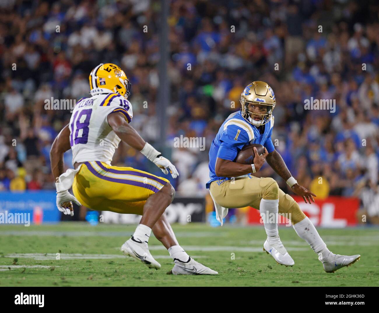 Pasadena, California, USA. 04th Sep, 2021. UCLA Bruins quarterback Dorian Thompson-Robinson #1 carries the ball as LSU Tigers linebacker Damone Clark #18 defends during the NCAA football game between the UCLA Bruins and the LSU Tigers at the Rose Bowl in Pasadena, California. Mandatory Photo Credit : Charles Baus/CSM/Alamy Live News Stock Photo